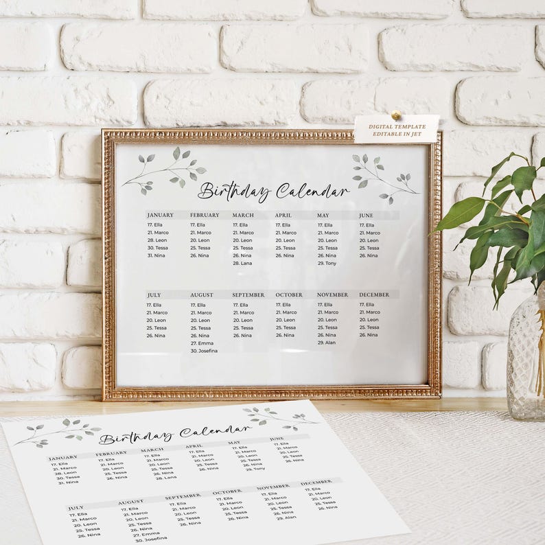May include: A framed "Birthday Calendar" print with a gold-colored frame, displayed on a white surface. The calendar features a minimalist design with a floral motif and a list of names and dates. A loose print of the same calendar is in the foreground.