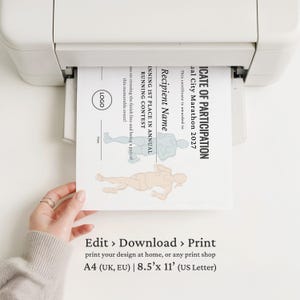 May include: A white printer outputting a Certificate of Participation for the 2027 City Marathon. The document features text, a logo placeholder, and two runner illustrations. Below the printer, text reads Edit, Download, Print, A4, and 8.5 inches by 11 inches.