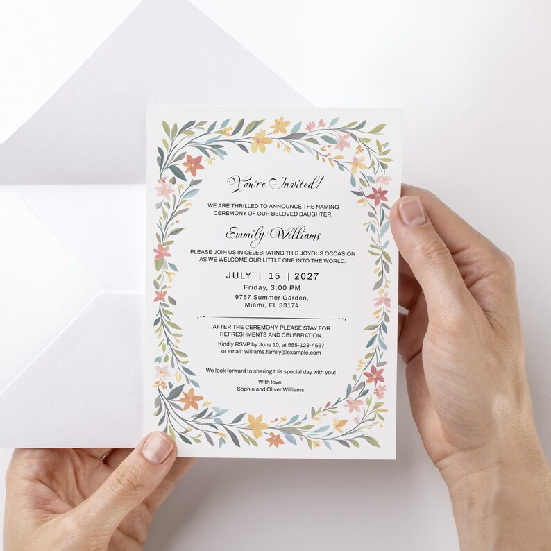 May include: A white rectangular invitation card featuring a floral border of green leaves and small flowers in shades of yellow, pink, and blue. The text reads: You're Invited! We are thrilled to announce the naming ceremony of our beloved daughter, Emmily Williams. Please join us in celebrating this joyous occasion as we welcome our little one into the world. July 15, 2027, Friday, 3:00 PM, 9757 Summer Garden, Miami, FL 33174. After the ceremony, please stay for refreshments and celebration. Kindly RSVP by June 10, at 655-123-4567 or email: williams.family@example.com. We look forward to sharing this special day with you! With love, Sophie and Oliver Williams.