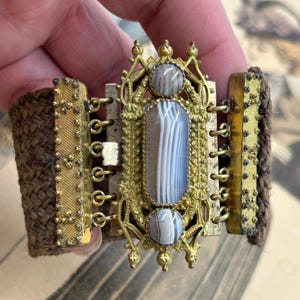 Antique georgian cuff mourning bracelet of woven hair and ornate gilt metal fastener with agates