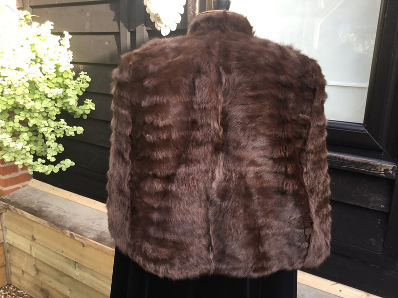 Vintage fur cape with arm slits 1950s from Brahams Norwich horizontal seaming