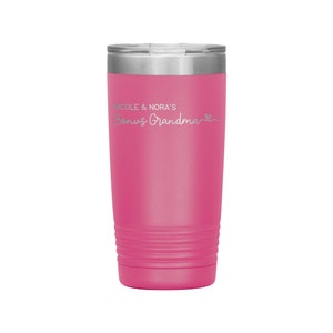 May include: Pink stainless steel tumbler with a silver lid and the text "Nicole & Nora's Bonus Grandma" in silver lettering.