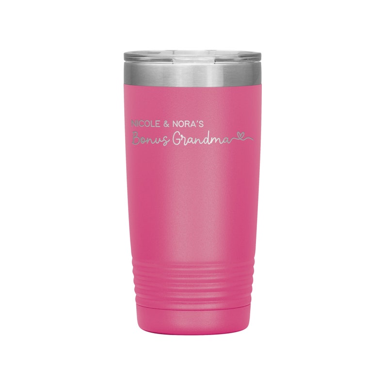 May include: Pink stainless steel tumbler with a silver lid and the text "Nicole & Nora's Bonus Grandma" in silver lettering.