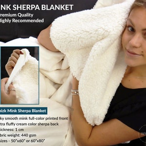 May include: A white mink sherpa blanket with a silky smooth printed front and a fluffy cream sherpa back. The blanket is 1 inch thick and weighs 440 grams per square meter. It is available in two sizes: 50 inches by 60 inches or 60 inches by 80 inches.