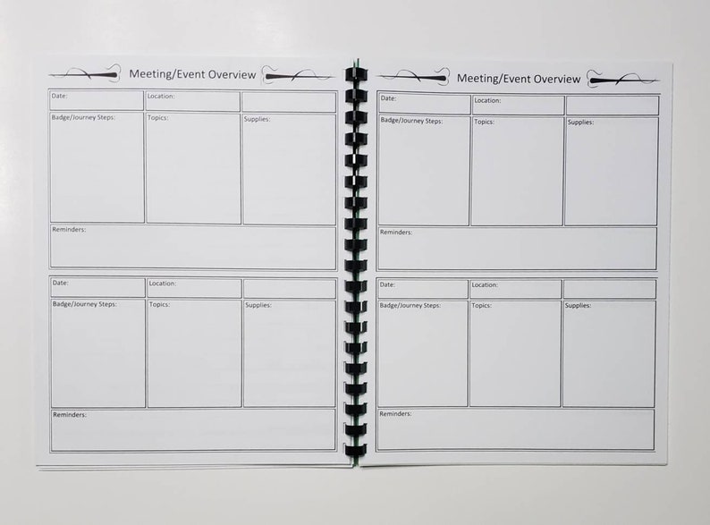 May include: Open notebook with a spiral binding, featuring a "Meeting/Event Overview" layout. The pages are white with black lines, creating sections for date, location, topics, supplies, and reminders. The notebook is designed for organizing meetings and events.