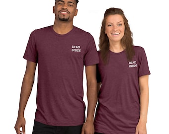 May include: Two maroon t-shirts with the text "DEAD INSIDE" embroidered in white on the front.