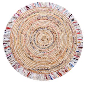 May include: Circular jute rug in a spiral pattern. The rug has a natural beige hue with colourful accents of red, blue, and white. The edge is finished with a fringe trim, adding texture. Suitable for various home decor styles. The diameter is approximately 120 cm.
