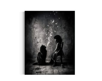 May include: A black and white digital art print featuring a dark-haired child sitting on a wooden chair facing a large, fluffy black cat. A swirling plume of smoke rises from the cat, transforming into small butterflies, stars, and a crescent moon.