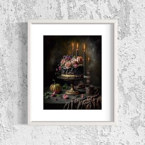 May include: A dark chocolate cake decorated with pink and purple flowers, lit by three black candles. The cake is on a gold cake stand and a small pumpkin sits on the table next to it.