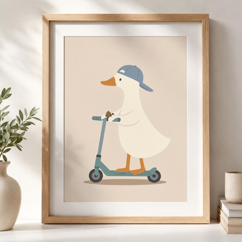 May include: A framed wall art print featuring a white duck wearing a blue baseball cap and riding a teal kick scooter. The duck has an orange beak and orange feet, and it is holding a small brown object while standing on the scooter deck.