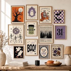 Puede incluir: Una pared de galería con doce láminas artísticas enmarcadas con temática de Halloween que incluyen esqueletos, fantasmas, murciélagos, un monstruo de Frankenstein y textos como 'you look boos-tiful', 'The Cauldron Chronicle', '31 october' y 'BOO'.
