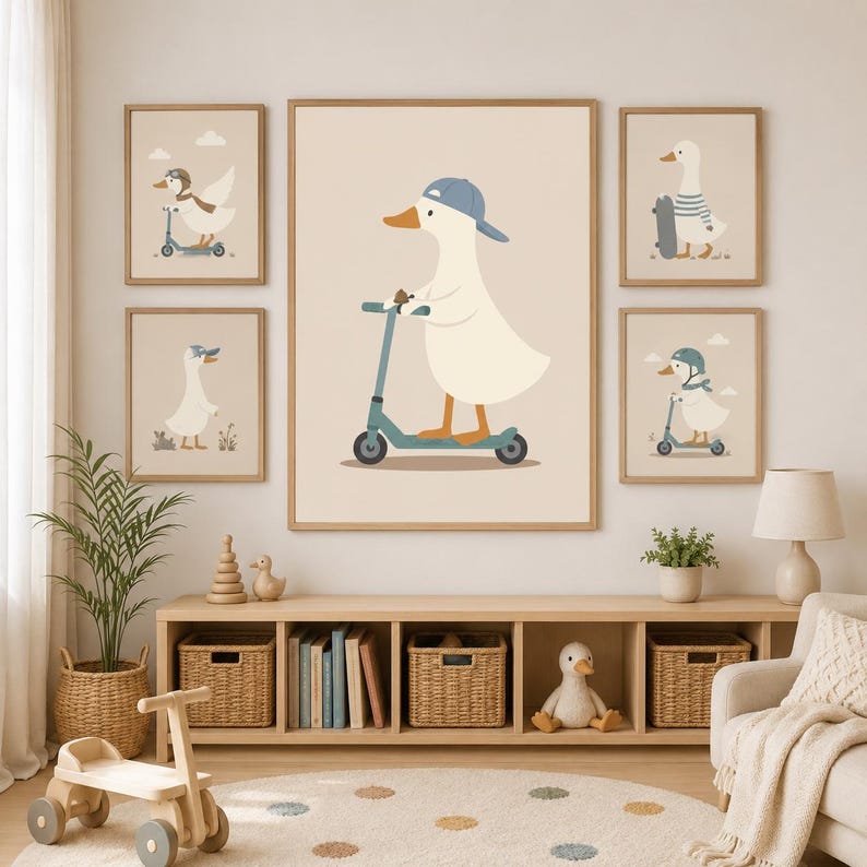 May include: A set of five framed wall art prints featuring illustrations of white ducks. The central large print shows a duck wearing a blue baseball cap riding a teal scooter. The four smaller surrounding prints depict ducks with scooters, skateboards, and helmets in a consistent color palette of beige, blue, and orange.