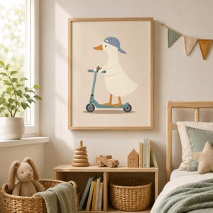 May include: A framed wall art print featuring a cartoon duck wearing a blue baseball cap and riding a teal kick scooter. The duck has a white body, orange beak, and orange feet, set against a solid light beige background within a wooden frame.