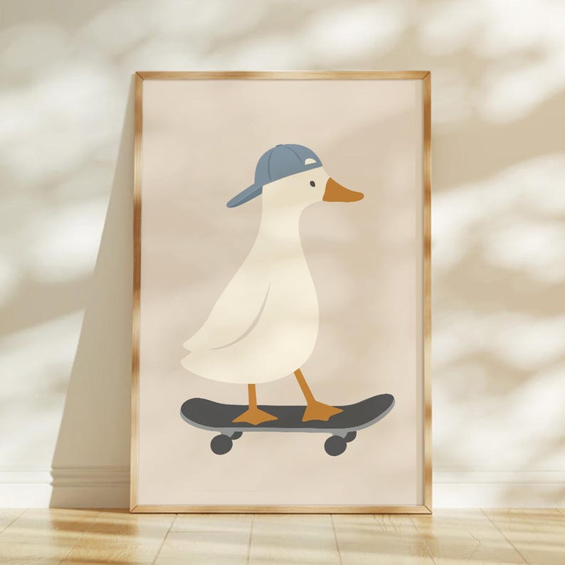 May include: A framed illustration of a white duck wearing a blue baseball cap, riding a black skateboard. The duck has an orange beak and feet. The background is a light beige color.