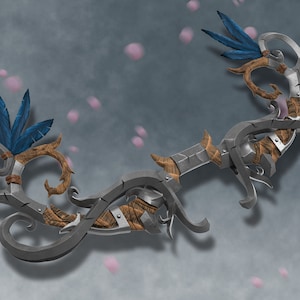 May include: A silver bow with a wooden handle and blue feathers. The bow is decorated with intricate carvings and has a vine-like design.