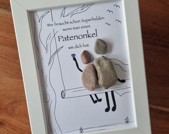 May include: A framed drawing of a couple sitting on a swing with the text "Wer braucht schon Superhelden wenn man einen Patenonkel wie dich hat."  The couple is made of stones.