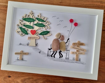 May include: Framed artwork featuring a wooden tree with names on green leaves and a red heart. A couple made of stones sits on a bench, with balloons. Text includes "10 Jahre" and "Alles Liebe zur Rosenhochzeit 34.02.2024".