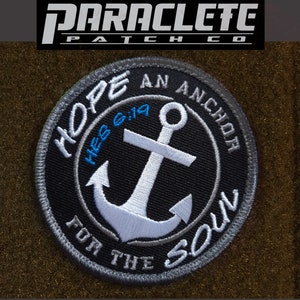 May include: Black and gray embroidered patch with a white anchor and the text "HOPE AN ANCHOR FOR THE SOUL" and "HEB 6:19" in blue.