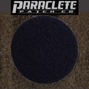 May include: A black, round, felt patch with the text "PARACLEFE PATCH CO" in white.