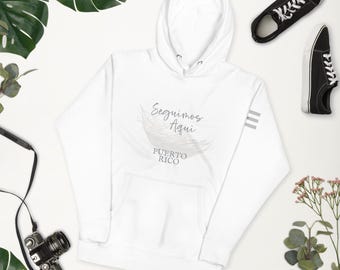 Seguimos Aqui! We're Still Here, SuperBowl HalfTime Show, Statement Hoodie, Unisex, Country Flag on Sleeve, Pava Hat, The Americas