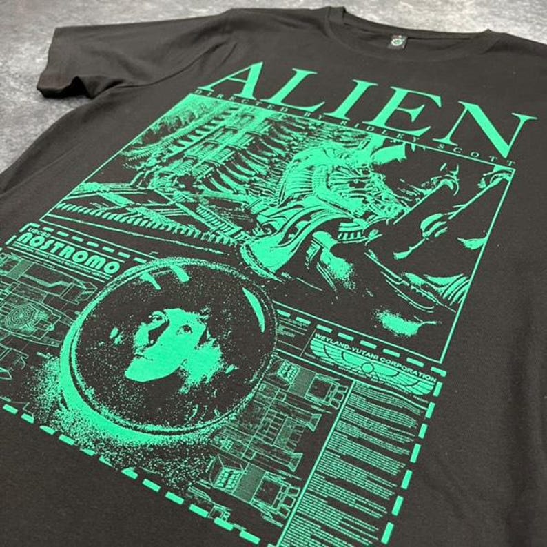 May include: Black t-shirt with a green graphic print of the alien from the movie "Alien" directed by Ridley Scott. The graphic includes the text "Alien" and "Nostromo".