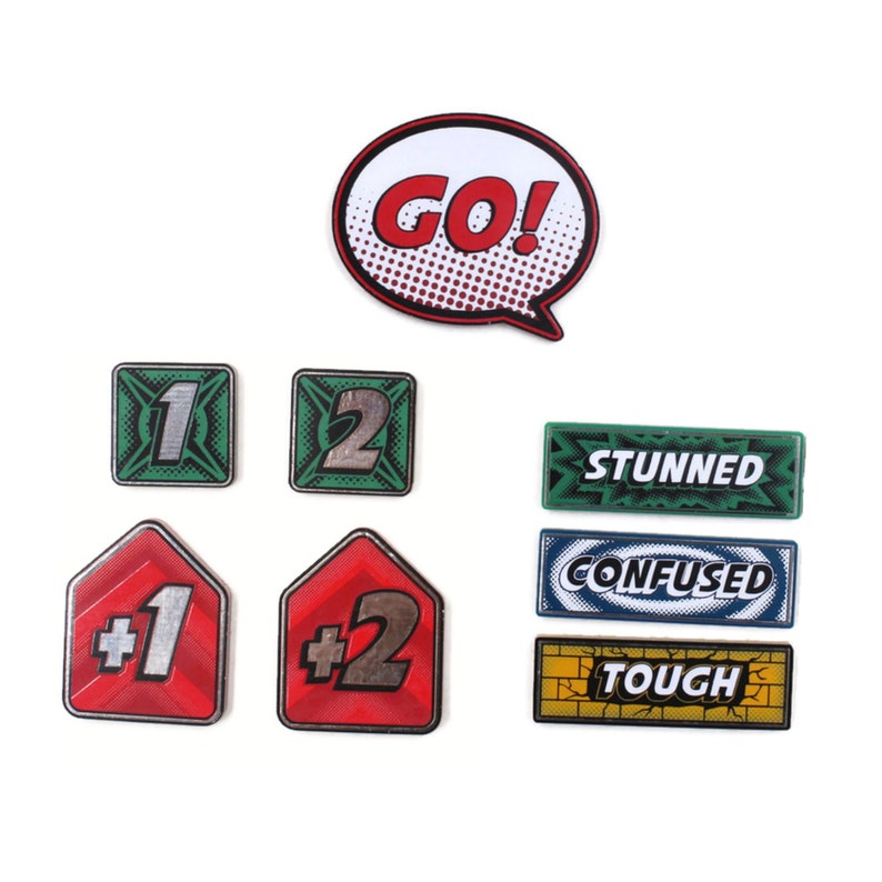 May include: A set of game pieces for a board game. The pieces are made of cardboard and feature different colours and designs. The pieces include a red and silver "GO!" speech bubble, green and silver number tiles, red and silver number tiles, and green, blue, and yellow rectangular tiles with text that reads "STUNNED", "CONFUSED", and "TOUGH".