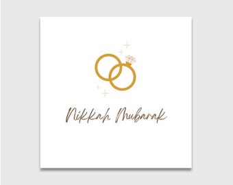Puede incluir: Tarjeta cuadrada blanca con un gráfico de anillos de boda dorados y las palabras "Nikkah Mubarak" en una fuente marrón. Los anillos están entrelazados, uno de ellos con un diamante.