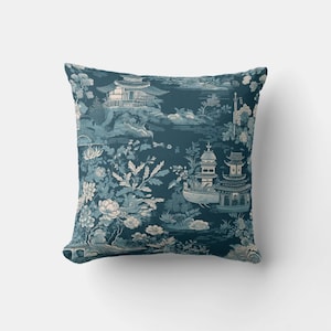 May include: A blue throw pillow with a white and light blue patterned design featuring Chinese-inspired architecture and floral motifs.