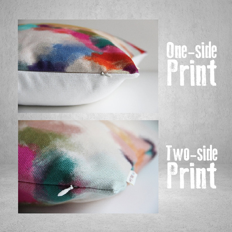 May include: Close-up of two decorative throw pillows with abstract watercolor designs. One pillow features a one-sided print, while the other showcases a two-sided print. The pillows have a white background and a zipper closure.