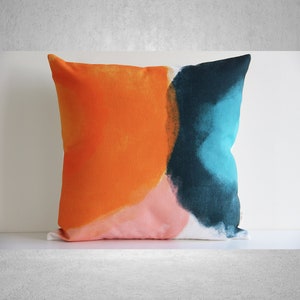 Funda de cojín abstracta con diseño de bloques de colores, naranja, verde y rosa, 18 x 18 y 20 x 20 cm.