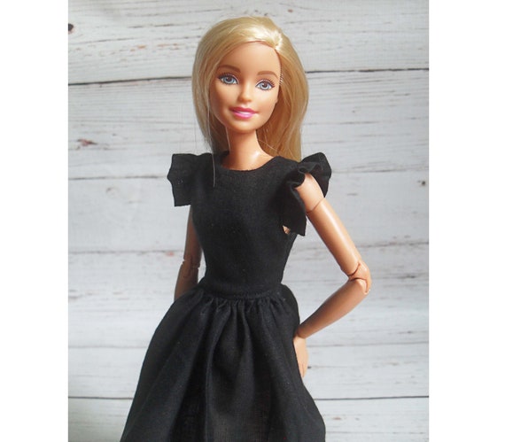 barbie doll in black dress