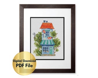 May include: A cross-stitch pattern featuring a blue and green house with a red roof and a green awning. The house has a small window and a door. There are trees and a street lamp in front of the house.