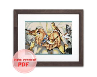 May include: A digital download PDF pattern for cross stitch featuring a painting of a hand with birds perched on it. The hand is surrounded by a white background with a cross in the background. The birds are a variety of colors, including blue, yellow, brown, and white.