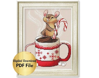 May include: A cross-stitch pattern featuring a cute cartoon mouse holding a candy cane and sitting in a red and white mug with snowflakes. The mug is filled with brown liquid and there are marshmallows on the side.