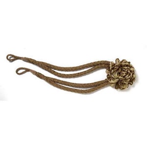 May include: A set of brown and beige rope curtain tiebacks with a decorative tassel knot at the end.