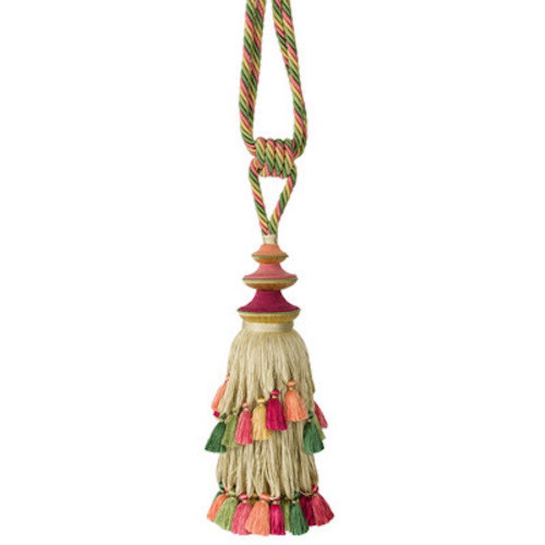 May include: A multi-colored tassel with a layered, tiered design. The tassel is made of natural fibers and features a multi-colored, layered, and tiered design. The tassel is attached to a multi-colored cord.