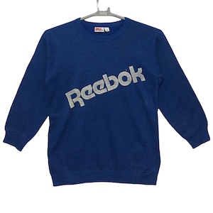 Sudadera vintage Reebok de los años 80 con logo grande, talla pequeña, color azul.