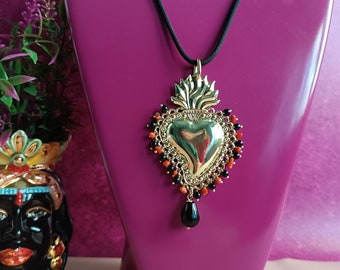 Black rope necklace with sacred heart pendant