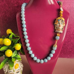 Sicilian necklace with light blue stones and ceramic moor head