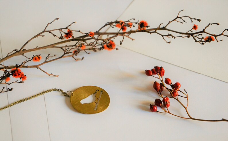 Bird on branch pendant necklace bronze