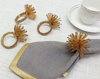 A set of 4/6/8/10 long gold bead napkin rings
