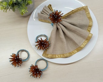 Brown and blue handmade beaded napkin rings. A set of 4 napkin rings