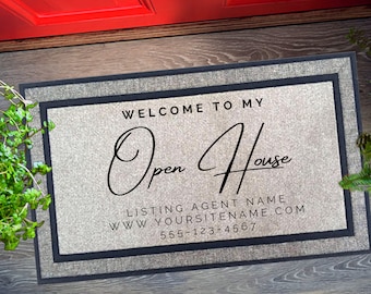 May include: A rectangular doormat with a light beige center and a dark gray border. The text "WELCOME TO MY Open House" is displayed in black script. Below, it reads "LISTING AGENT NAME" and a website and phone number.