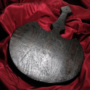 Giant black paddle in oak wood