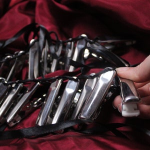 Corset zipper clamps