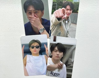 May include: Four photo cards featuring a young man in different poses. The first card shows the man covering his mouth with his hand. The second card shows the man pointing at the camera. The third card shows the man wearing sunglasses and making a peace sign with both hands. The fourth card shows the man wearing a white shirt with the word "SLEEPY" printed on it.