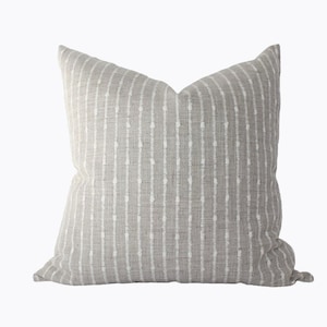 light gray and  cream striped pillow cover.