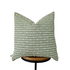 Housse de coussin à rayures vertes et crème