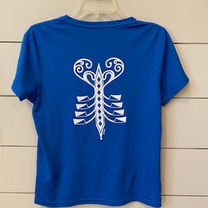 May include: A royal blue short-sleeved t-shirt with a white graphic of a stylised lobster on the back.