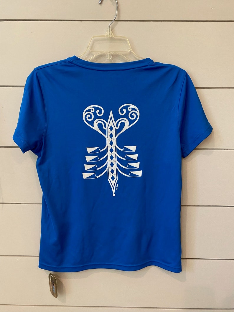 May include: A royal blue short-sleeved t-shirt with a white graphic of a stylised lobster on the back.